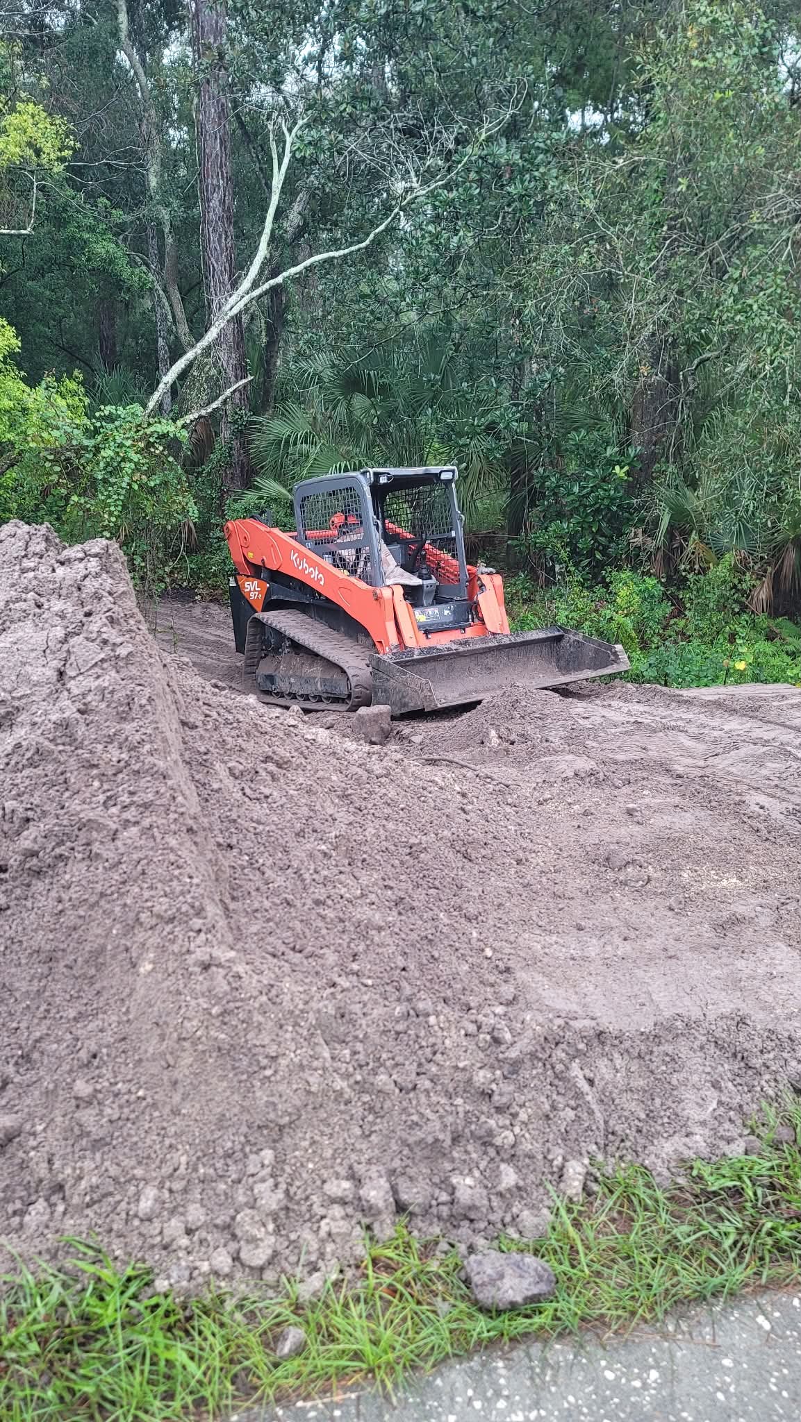Tracked Kubota loader working a dirt project